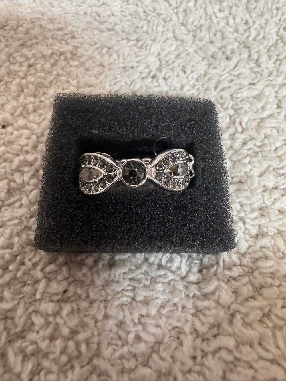 Silver Tone Bow Ring with Clear and Greenish Stone